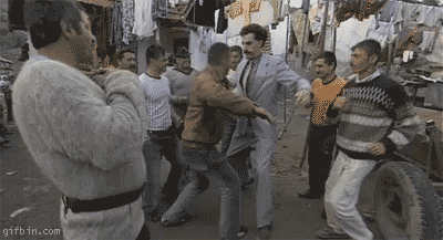 1237362987_borat_dancing_with_his_fellow_karakstan  ians.gif